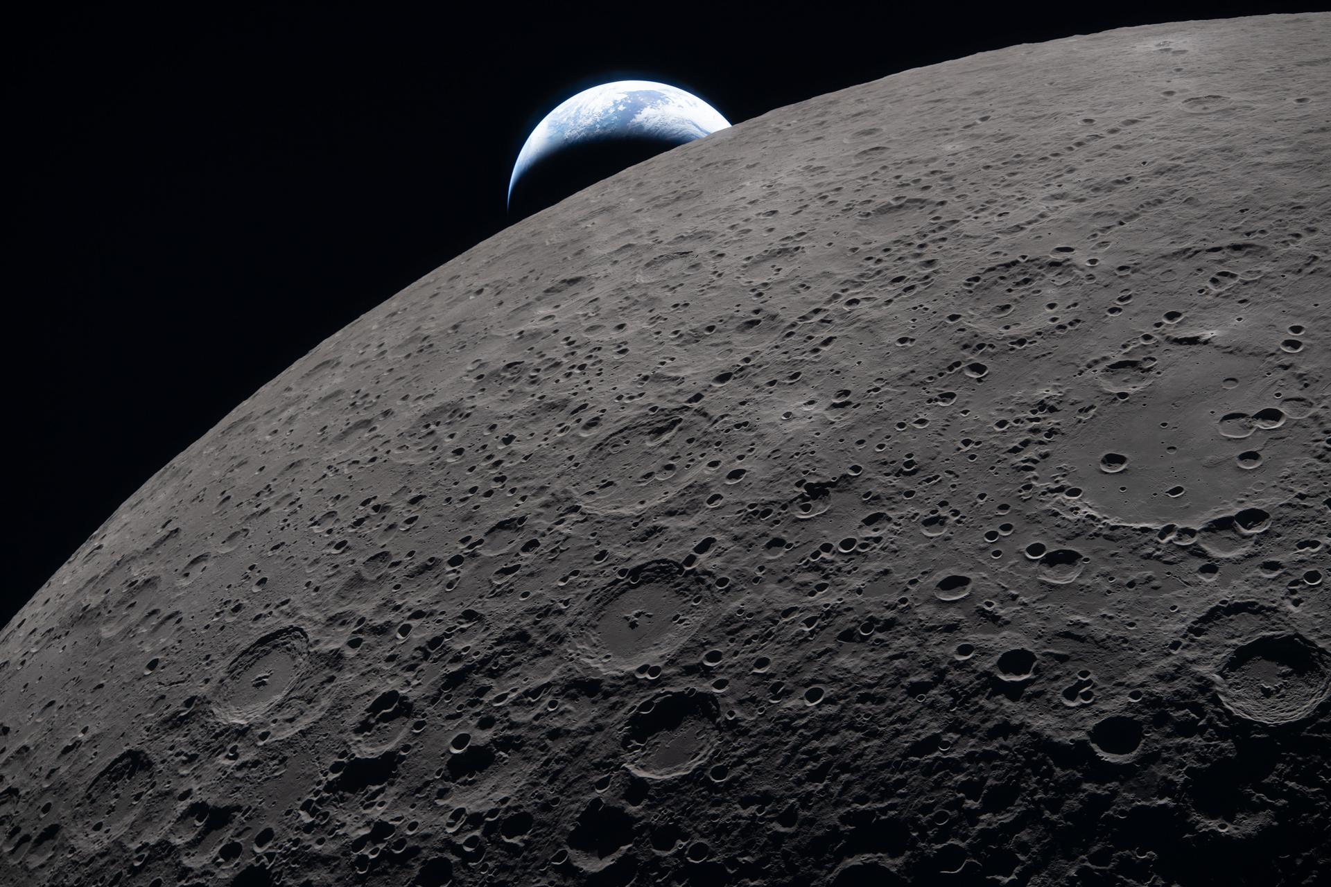 Earthset captured through the Orion spacecraft window at 6:41 p.m. EDT, April 6, 2026, during the Artemis II crew’s flyby of the Moon.