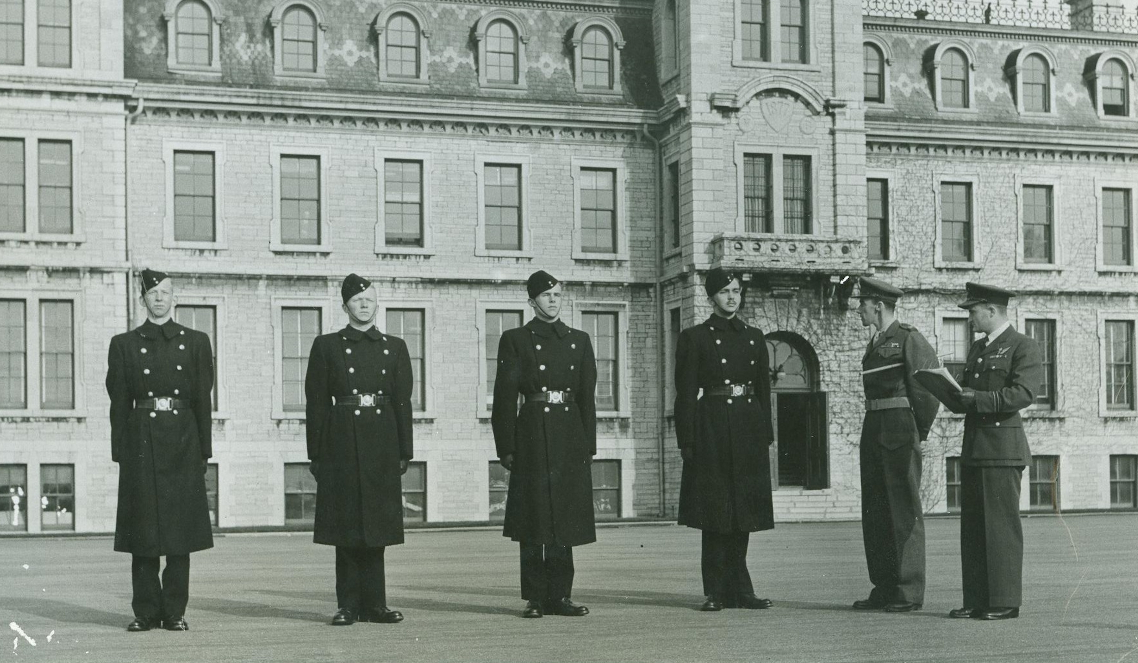 Four cadets are inspected on the RMC Parade Square 